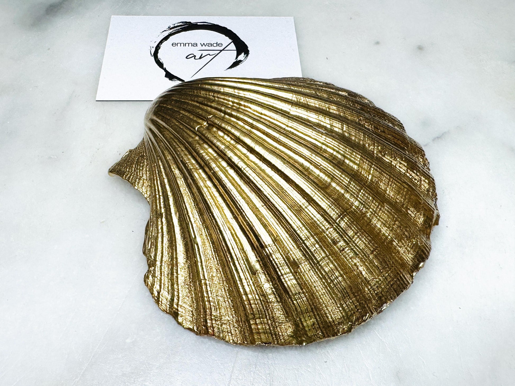 Elegant red and gold floral scallop shell trinket dish, hand-painted and gilded with liquid gold leaf before being sealed in crystal-clear resin. Each shell is a one-of-a-kind Dorset creation, perfect as a jewellery holder, tea light dish, or coastal home décor accent. A beautiful handmade ocean-inspired gift, presented in eco-friendly packaging and finished with sustainable care and artistry