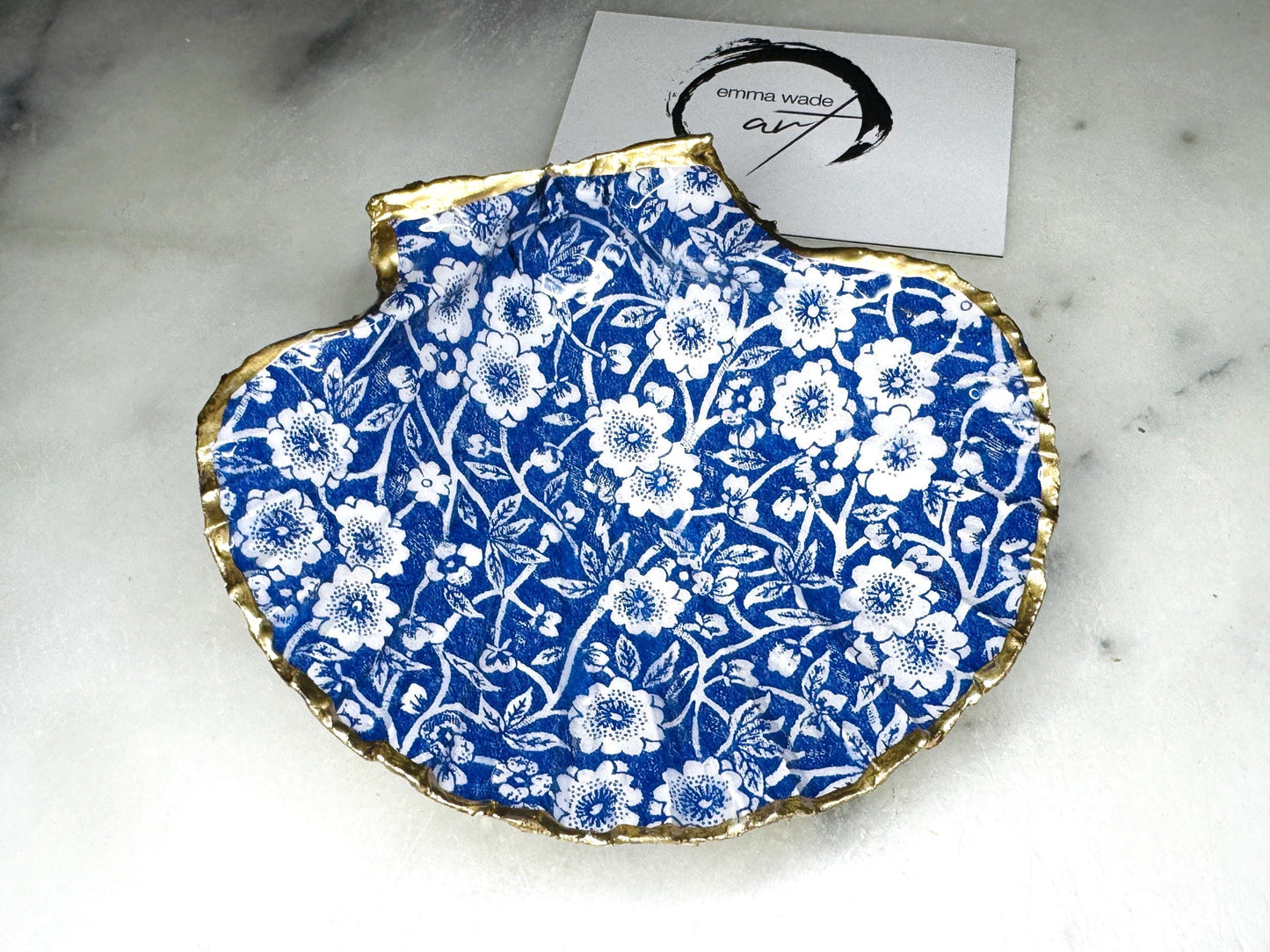 blue and white floral scallop shell dish, Dorset handmade oyster shell jewellery holder, gold leaf scallop shell trinket dish, coastal ring holder dish, sustainable scallop shell ornament, artisan jewellery dish UK, scallop shell salt and pepper pinch pot, floral scallop shell vanity tray, handmade scallop shell gift for her, blue and white coastal home decor dish, unique Dorset scallop shell trinket storage, hand gilded scallop shell decorative dish, UK handmade artisan shell gift