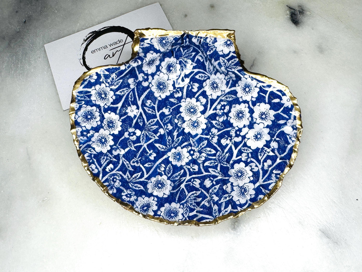 blue and white floral scallop shell dish, Dorset handmade oyster shell jewellery holder, gold leaf scallop shell trinket dish, coastal ring holder dish, sustainable scallop shell ornament, artisan jewellery dish UK, scallop shell salt and pepper pinch pot, floral scallop shell vanity tray, handmade scallop shell gift for her, blue and white coastal home decor dish, unique Dorset scallop shell trinket storage, hand gilded scallop shell decorative dish, UK handmade artisan shell gift