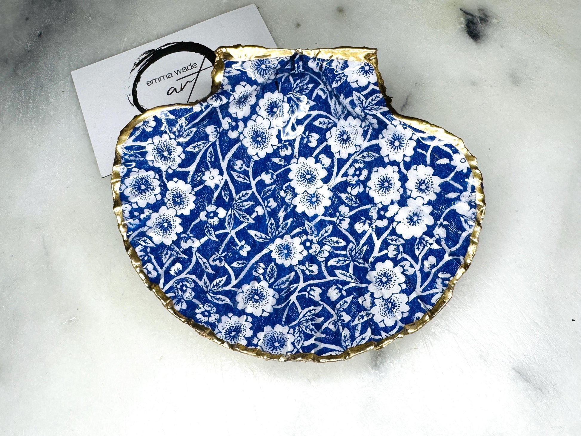 blue and white floral scallop shell dish, Dorset handmade oyster shell jewellery holder, gold leaf scallop shell trinket dish, coastal ring holder dish, sustainable scallop shell ornament, artisan jewellery dish UK, scallop shell salt and pepper pinch pot, floral scallop shell vanity tray, handmade scallop shell gift for her, blue and white coastal home decor dish, unique Dorset scallop shell trinket storage, hand gilded scallop shell decorative dish, UK handmade artisan shell gift