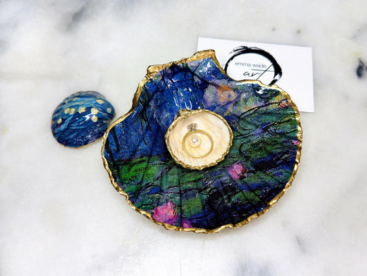 Claude Monet Waterlilies inspired shell dish set featuring a scallop trinket dish and cockle ring holder | Decorated with blue and pink floral waterlilies | Gilded with real gold leaf and sealed in high gloss resin | Perfect as a wedding ring tray, jewellery dish, or vanity display | Handmade in Dorset from sustainably sourced shells | A coastal art-inspired gift for weddings, birthdays, or anniversaries