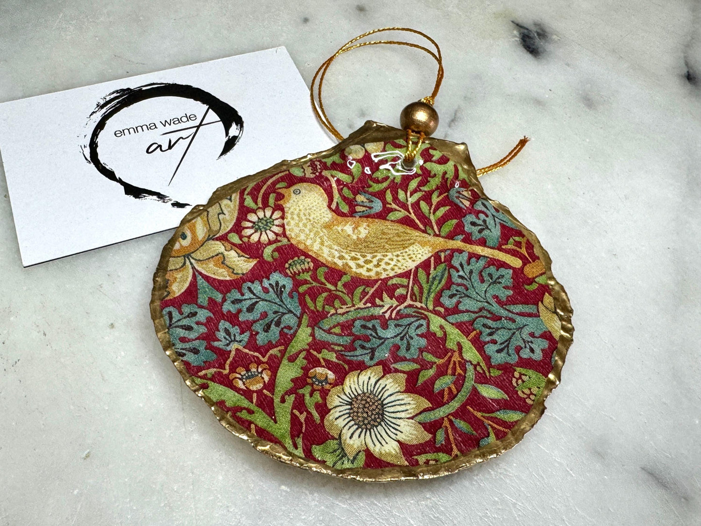 William Morris Strawberry Thief scallop shell ornaments, handmade Dorset scallop shell hanging decorations, gold leaf gilded flat shell ornaments, coastal Christmas tree decorations, Strawberry Thief William Morris nature inspired shell art, oyster and scallop shell hanging gifts, eco friendly handmade scallop shell decor UK, unique William Morris scallop ornaments for weddings, anniversaries, or new home, handmade Dorset scallop shell ornaments with gold string and gift box packaging