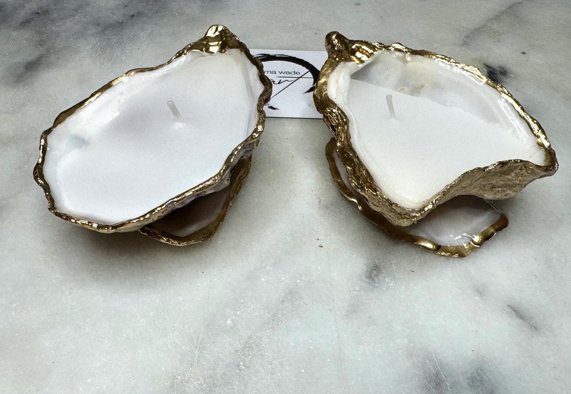 oyster shell candle, gold oyster candle, gilded oyster shells, hand poured candle, coastal decor, ocean inspired candle, beach home decor, sustainable candle, handmade in Surrey, luxury shell candle, sea lover gift, oyster shell pair, artisan candle, eco friendly candle, gold rim shell, nautical decor, ocean gift, coastal homeware, handmade oyster shell candle, shell wedding decor, seaside candle, mother of pearl shell, gold edged candle, beach cottage style, elegant coastal gift