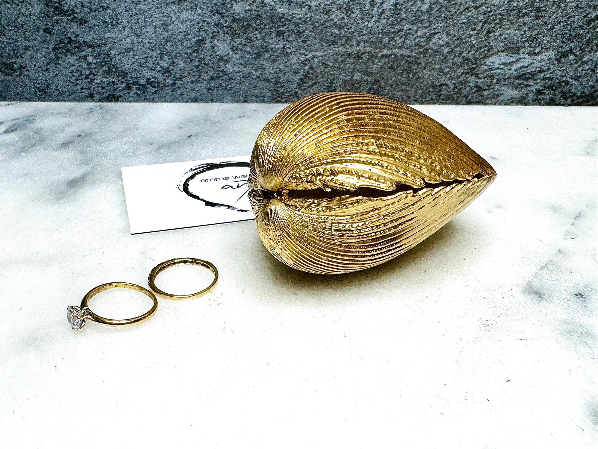 Handmade gold gilded cockle shell jewellery box with pearly white interior and optional freshwater pearl necklace. Coastal shell ring box crafted from natural Dorset shells, edged with liquid gold leaf and presented in a luxury gift box. Elegant seaside-inspired keepsake gift for weddings, bridesmaids, birthdays, anniversaries, or jewellery storage.