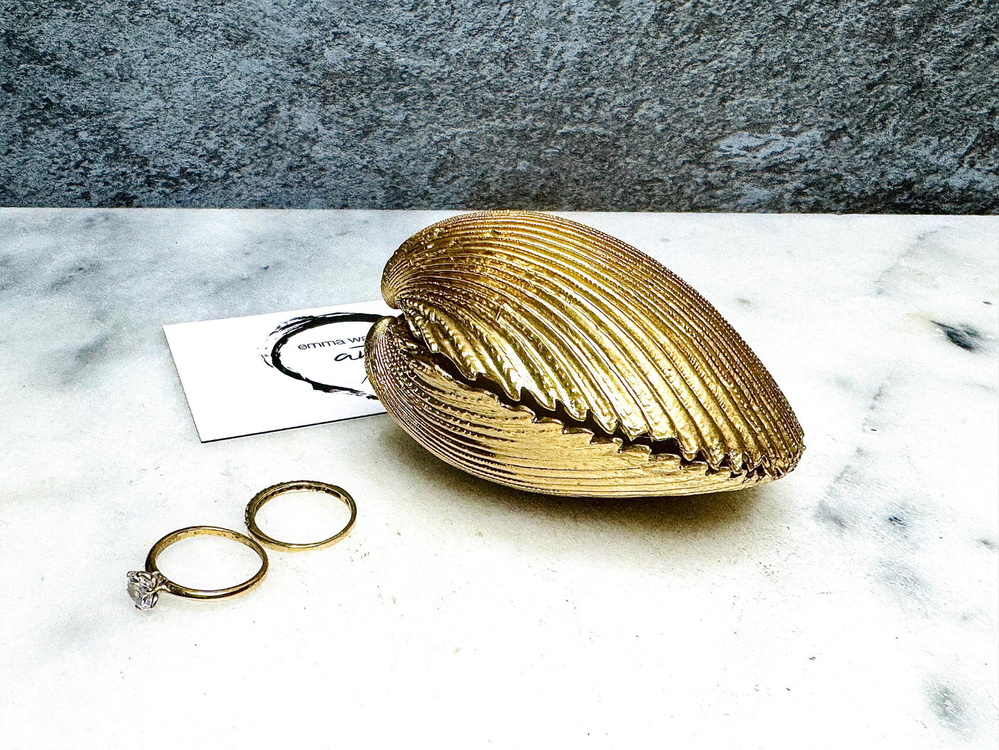 Handmade gold gilded cockle shell jewellery box with pearly white interior and optional freshwater pearl necklace. Coastal shell ring box crafted from natural Dorset shells, edged with liquid gold leaf and presented in a luxury gift box. Elegant seaside-inspired keepsake gift for weddings, bridesmaids, birthdays, anniversaries, or jewellery storage.
