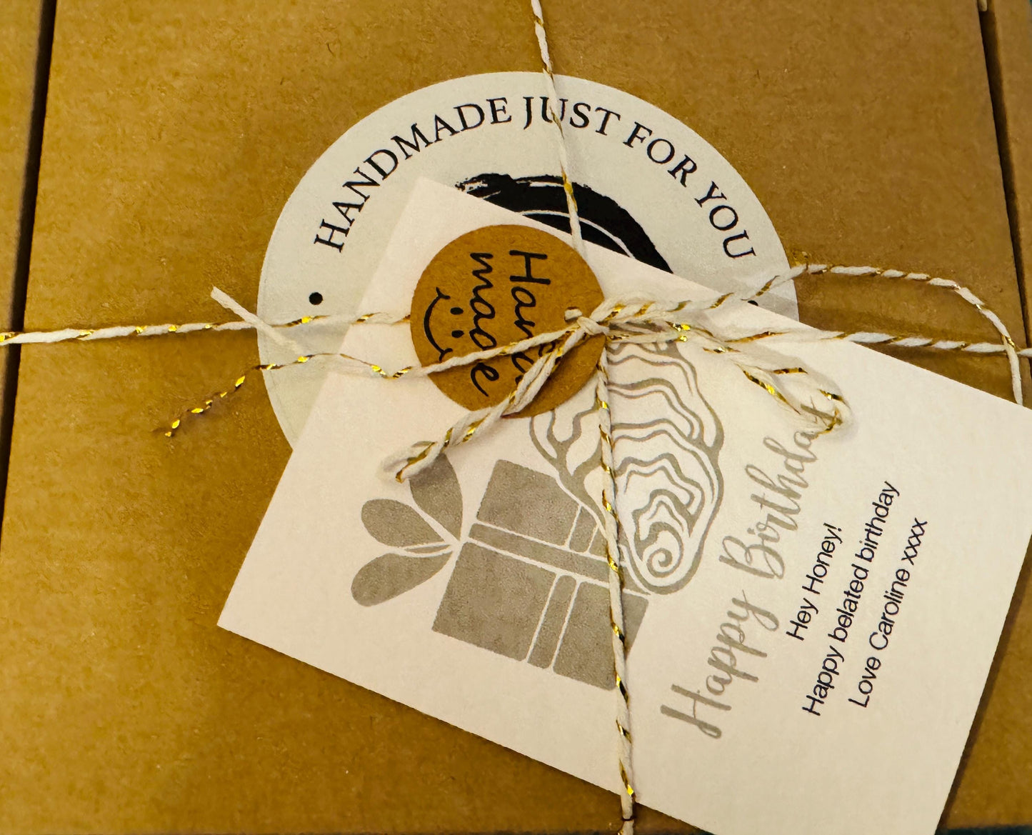 Gift packaging for a handcrafted oyster shell ring box, wrapped in brown paper and tied with natural string. A “Handmade just for you” sticker and branded gift tag are attached, showing the eco-friendly presentation and ready-to-gift packaging for a jewellery or keepsake oyster shell box.