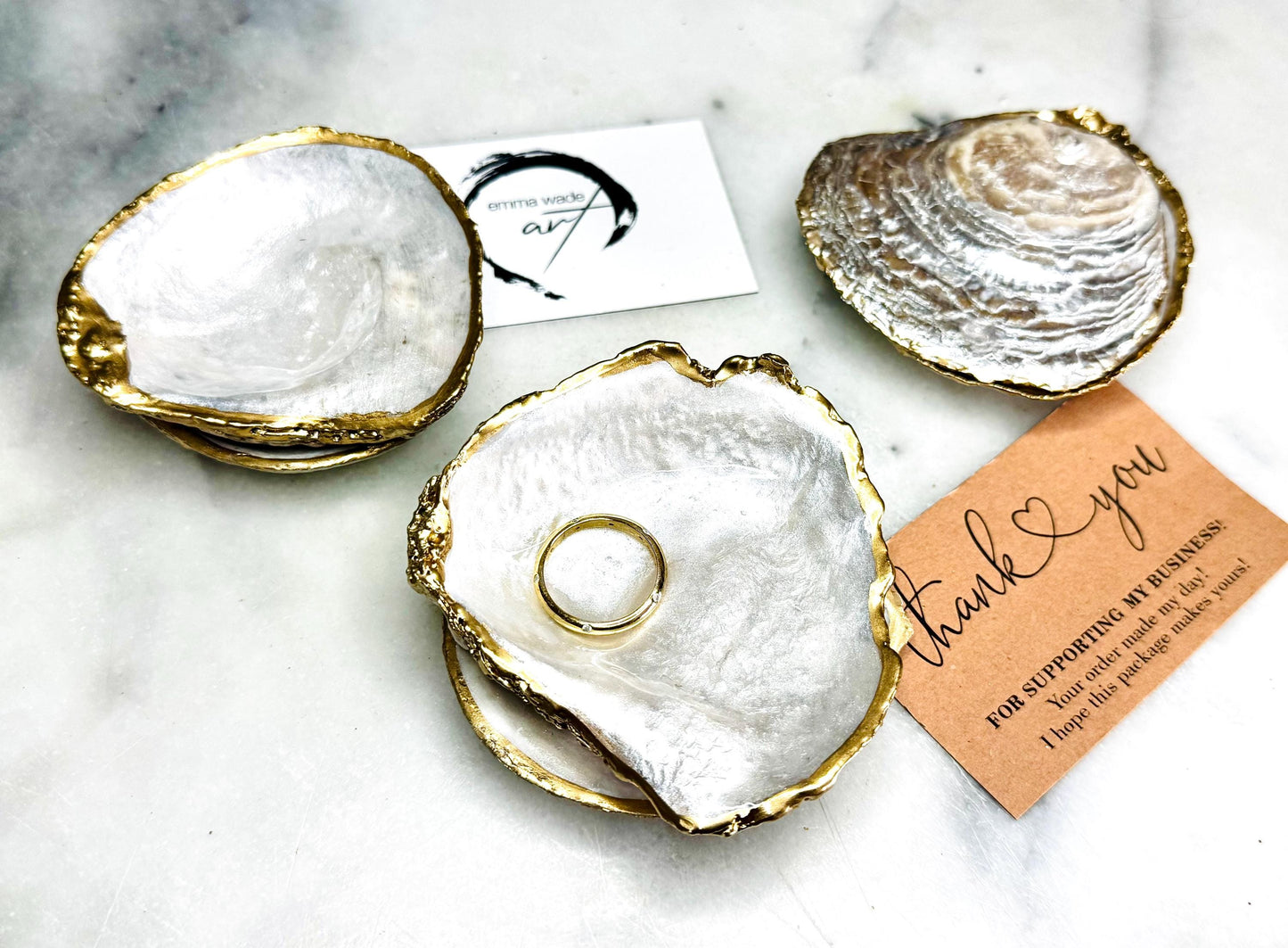 Natural saddle oyster shell ring box handcrafted with pearlised interior and exterior, sealed with high gloss resin and edged in liquid gold leaf, optional Swarovski pearl ring holder, elegant coastal wedding ring bearer box or proposal ring dish styled on neutral background