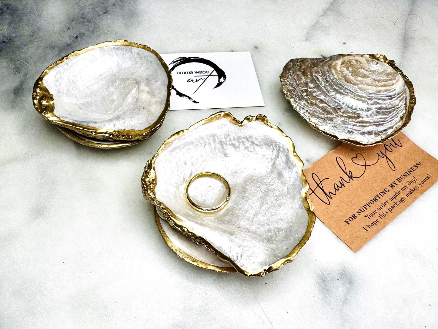 Handcrafted saddle oyster shell ring box with pearlescent finish inside and outside, gold leaf gilded edges and optional Swarovski pearl inset, coastal wedding ring bearer box, engagement proposal ring holder, luxury shell jewellery dish, unique handmade UK gift on marble backdrop
