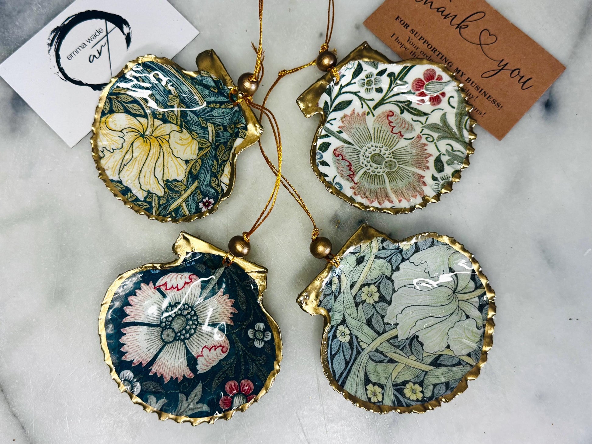 William Morris scallop shell ornaments sold individually or as set of 4, handmade Dorset shells with gold leaf gilded rims and backs, glossy resin interiors, Compton and Pimpernel floral designs, coastal hanging decorations with gold string, sustainable handmade gift, coastal home decor, Christmas ornament or unique shell gift