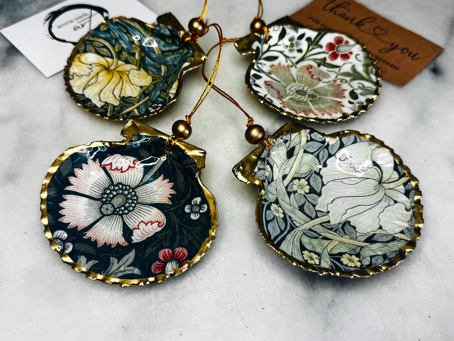 William Morris scallop shell ornaments sold individually or as set of 4, handmade Dorset shells with gold leaf gilded rims and backs, glossy resin interiors, Compton and Pimpernel floral designs, coastal hanging decorations with gold string, sustainable handmade gift, coastal home decor, Christmas ornament or unique shell gift