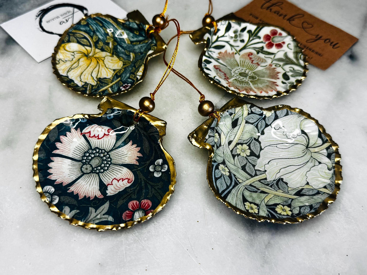 William Morris scallop shell ornaments sold individually or as set of 4, handmade Dorset shells with gold leaf gilded rims and backs, glossy resin interiors, Compton and Pimpernel floral designs, coastal hanging decorations with gold string, sustainable handmade gift, coastal home decor, Christmas ornament or unique shell gift