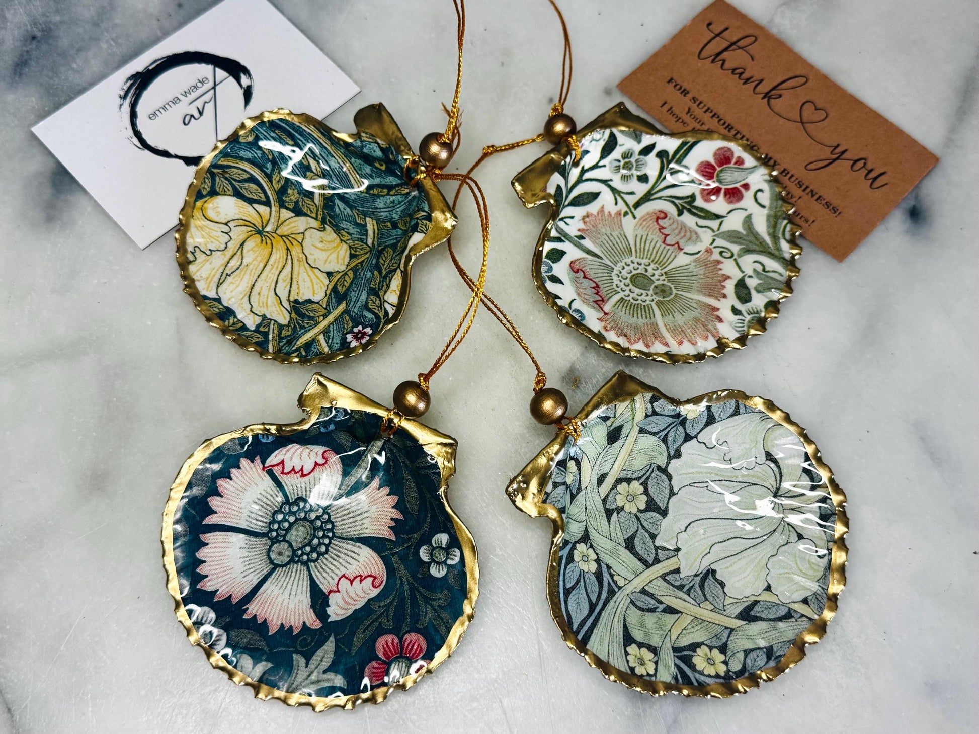 William Morris scallop shell ornaments sold individually or as set of 4, handmade Dorset shells with gold leaf gilded rims and backs, glossy resin interiors, Compton and Pimpernel floral designs, coastal hanging decorations with gold string, sustainable handmade gift, coastal home decor, Christmas ornament or unique shell gift