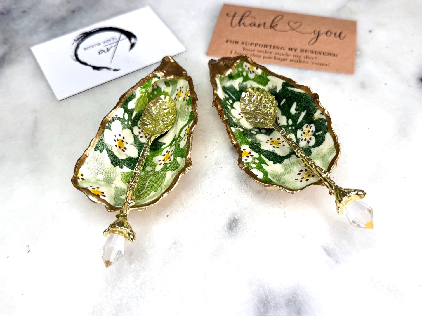 Pair of natural oyster shell salt and pepper pinch pots decorated with green Emma Bridgewater Hawthorn Berry floral design, finished with liquid gold leaf rims and sealed with clear food-safe resin. Optional ornate gold crystal spoons available. Handmade coastal tableware and host gift, suitable for weddings, Christmas dining, dinner parties and new home gifts.