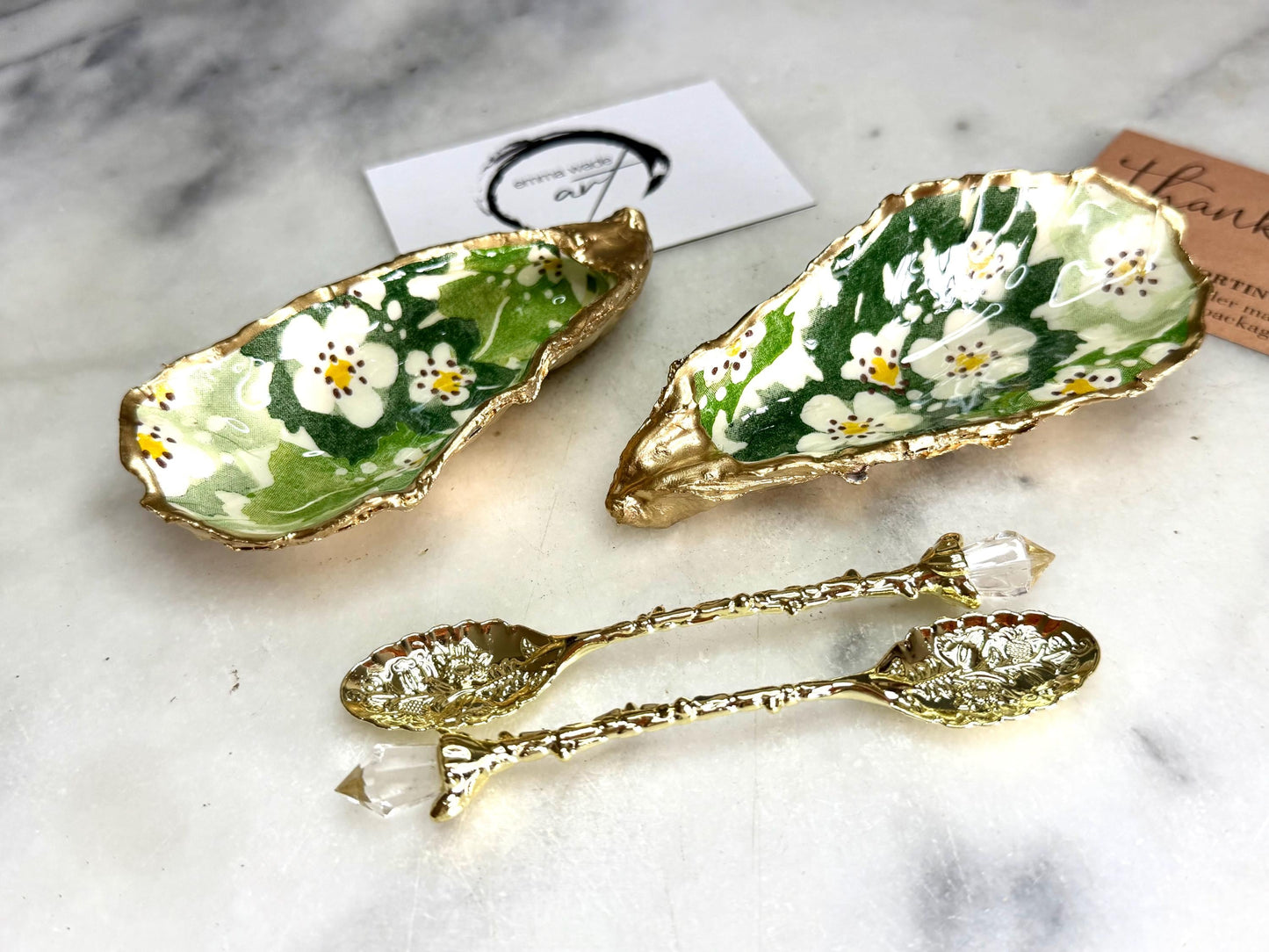 Pair of natural oyster shell salt and pepper pinch pots decorated with green Emma Bridgewater Hawthorn Berry floral design, finished with liquid gold leaf rims and sealed with clear food-safe resin. Optional ornate gold crystal spoons available. Handmade coastal tableware and host gift, suitable for weddings, Christmas dining, dinner parties and new home gifts.