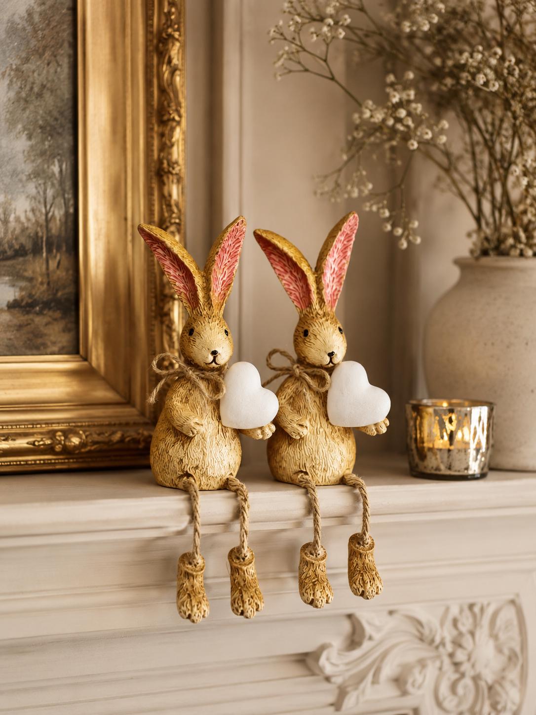 Hand finished brown bunny shelf sitter ornament with white heart and dangling jute legs, rustic polyresin rabbit decoration for shelves, mantels, nursery styling or Christmas home decor. Available individually or as a set of 2.