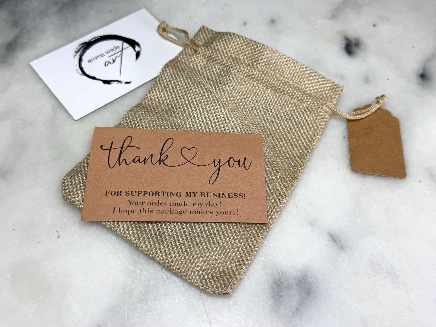 * Includes a reusable natural woven drawstring gift pouch
* Emma Wade ART presentation card and thank-you card included
* Kraft gift tag inclu